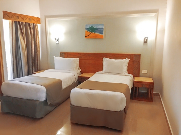 Imagen de la habitación del Hotel Green Leaves Aqua Park Beach Resort North Coast. Foto 7
