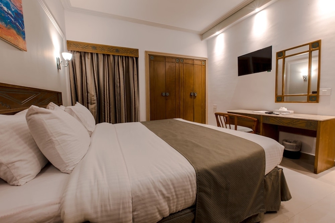 Imagen de la habitación del Hotel Green Leaves Aqua Park Beach Resort North Coast. Foto 11