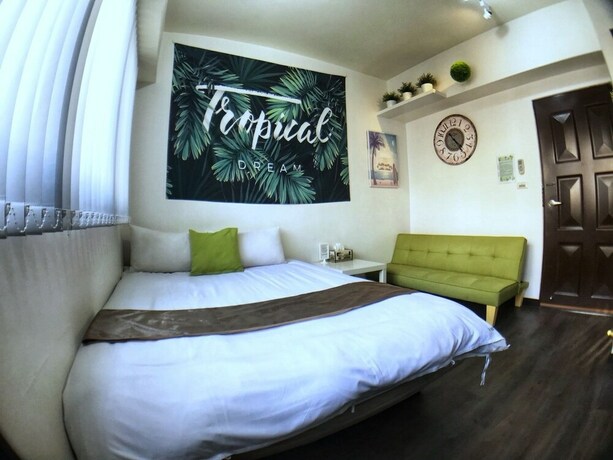 Imagen de la habitación del Hotel Green Mu. Foto 29