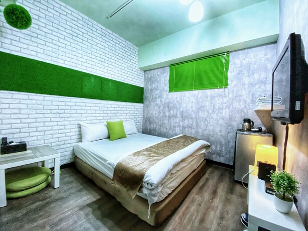 Imagen de la habitación del Hotel Green Mu. Foto 32