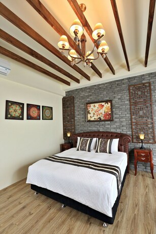 Imagen de la habitación del Hotel Green Resort, Wujie. Foto 19