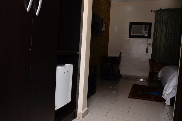 Imagen de la habitación del Hotel Green Suites Villa. Foto 13