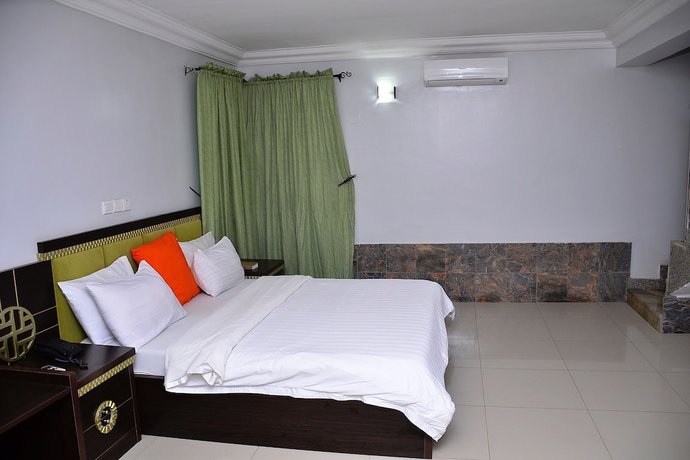 Imagen de la habitación del Hotel Green Suites Villa. Foto 15