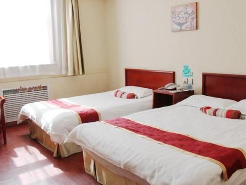 Imagen de la habitación del Hotel Green Tree Inn Express. Foto 5