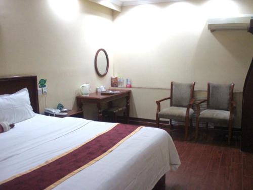 Imagen de la habitación del Hotel Green Tree Inn Express. Foto 7