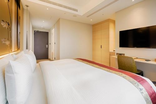 Imagen de la habitación del Hotel Green World Grand Nanjing. Foto 8