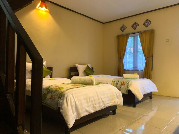 Imagen de la habitación del Hotel Green orry inn cafe and cottages. Foto 15