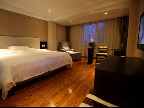 Imagen de la habitación del Hotel GreenTree Alliance YanTai YingChun Street Green Homeland Hotel. Foto 16