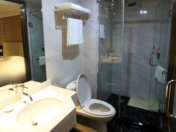 Imagen de la habitación del Hotel GreenTree Alliance YanTai YingChun Street Green Homeland Hotel. Foto 19