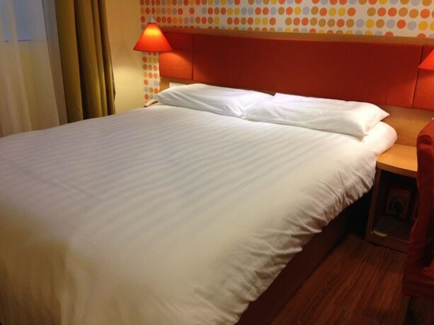 Imagen de la habitación del Hotel GreenTree Alliance YanTai YingChun Street Green Homeland Hotel. Foto 26