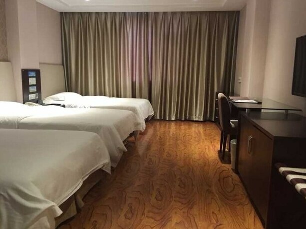 Imagen de la habitación del Hotel GreenTree Alliance YanTai YingChun Street Green Homeland Hotel. Foto 30