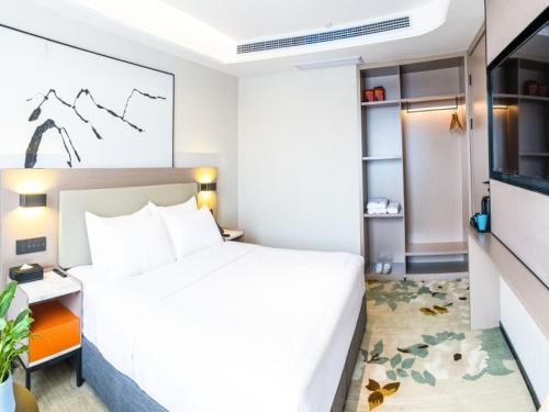 Imagen de la habitación del Hotel GreenTree Eastern Chongqing Yangjiaping Pedestrian Street Vientiane City. Foto 15