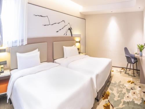 Imagen de la habitación del Hotel GreenTree Eastern Chongqing Yangjiaping Pedestrian Street Vientiane City. Foto 16