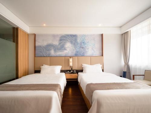 Imagen de la habitación del Hotel GreenTree Eastern Lihu Yuantouzhu Scenic Area. Foto 19