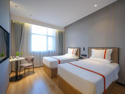 Imagen de la habitación del Hotel GreenTree Eastern Xinjiang Urumqi Xintianrun Airport. Foto 16