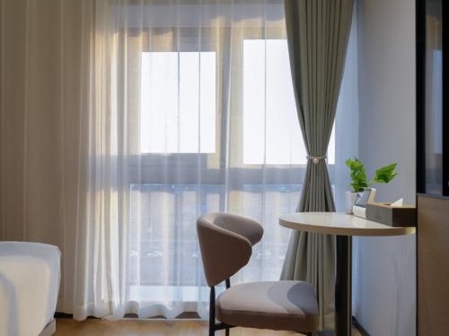 Imagen de la habitación del Hotel GreenTree Eastern Xinjiang Urumqi Xintianrun Airport. Foto 18