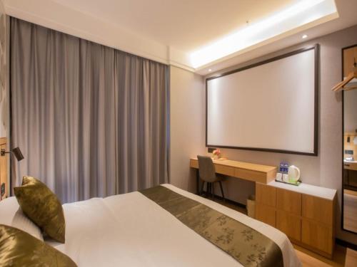 Imagen de la habitación del Hotel GreenTree Inn Express Changzhou Caoqiao Industrial Park. Foto 14
