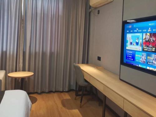 Imagen de la habitación del Hotel GreenTree Inn Express Changzhou Caoqiao Industrial Park. Foto 15