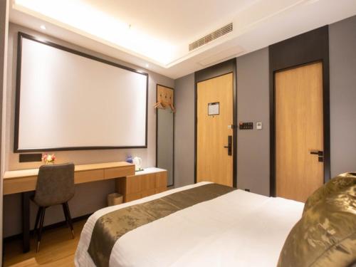 Imagen de la habitación del Hotel GreenTree Inn Express Changzhou Caoqiao Industrial Park. Foto 18
