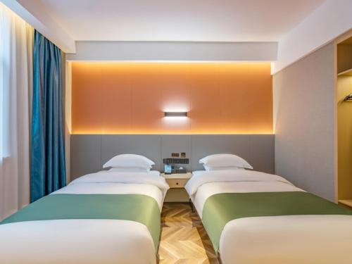 Imagen de la habitación del Hotel GreenTree Inn Express Changzhou Wujin Economic Development Zone Qishuyan Yaoguan. Foto 11