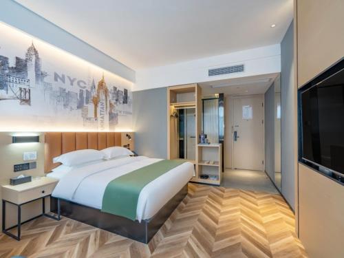 Imagen de la habitación del Hotel GreenTree Inn Express Changzhou Wujin Economic Development Zone Qishuyan Yaoguan. Foto 14