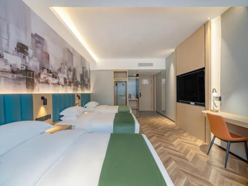 Imagen de la habitación del Hotel GreenTree Inn Express Changzhou Wujin Economic Development Zone Qishuyan Yaoguan. Foto 16