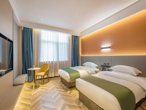 Imagen de la habitación del Hotel GreenTree Inn Express Changzhou Wujin Economic Development Zone Qishuyan Yaoguan. Foto 18