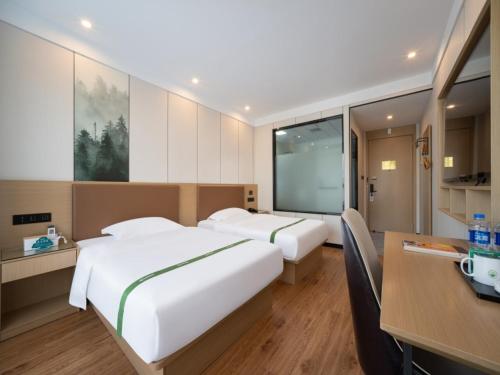 Imagen de la habitación del Hotel GreenTree Inn Express Suzhou Taicang West Nanjing Road. Foto 17