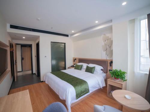Imagen de la habitación del Hotel GreenTree Inn Express Suzhou Zhangjianggang Free Trade Zone Central Plaza. Foto 6
