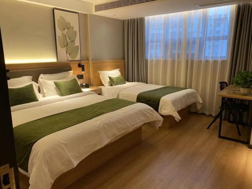 Imagen de la habitación del Hotel GreenTree Inn Express Suzhou Zhangjianggang Free Trade Zone Central Plaza. Foto 7
