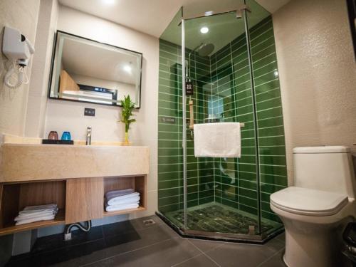 Imagen de la habitación del Hotel GreenTree Inn Express Suzhou Zhangjianggang Free Trade Zone Central Plaza. Foto 8