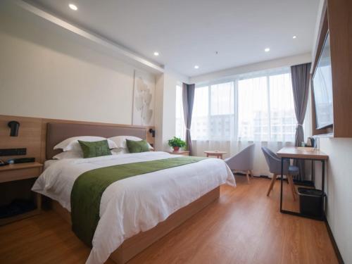 Imagen de la habitación del Hotel GreenTree Inn Express Suzhou Zhangjianggang Free Trade Zone Central Plaza. Foto 9