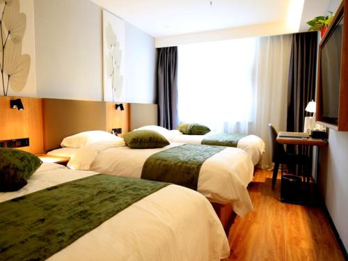Imagen de la habitación del Hotel GreenTree Inn Express Tianjin Jinnan National Convention and Exhibition Center. Foto 16