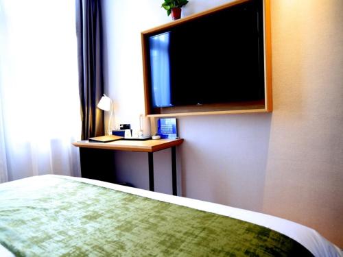 Imagen de la habitación del Hotel GreenTree Inn Express Tianjin Jinnan National Convention and Exhibition Center. Foto 17