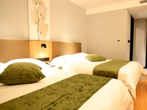 Imagen de la habitación del Hotel GreenTree Inn Express Tianjin Jinnan National Convention and Exhibition Center. Foto 19