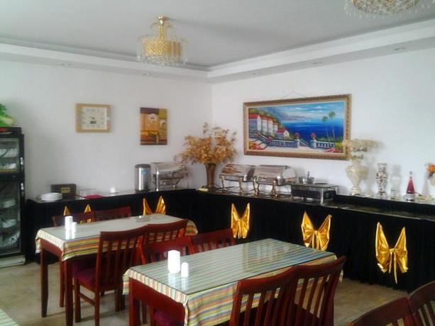 Imagen del bar/restaurante del Hotel GreenTree Inn Harbin Central Avenue. Foto 5