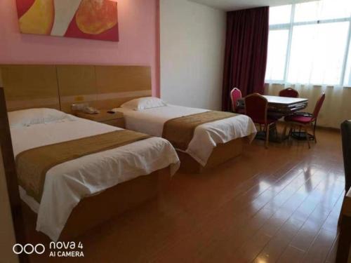 Imagen general del Hotel GreenTree Inn Shangrao Qianshan hekou old town Xinjiang longting shell hotel. Foto 11