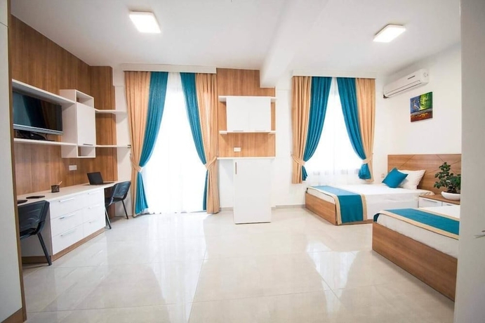 Imagen de la habitación del Hotel Greenland Premium Residence. Foto 7