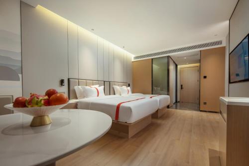 Imagen de la habitación del Hotel Greentree Eastern Tengchong. Foto 16