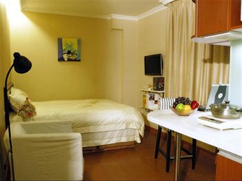 Imagen de la habitación del Hotel Greentree Inn Beijing Guangmingqiao Express Apartment. Foto 10