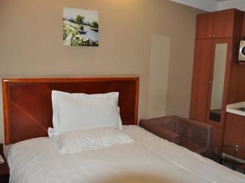 Imagen de la habitación del Hotel Greentree Inn Beijing Guangmingqiao Express Apartment. Foto 15