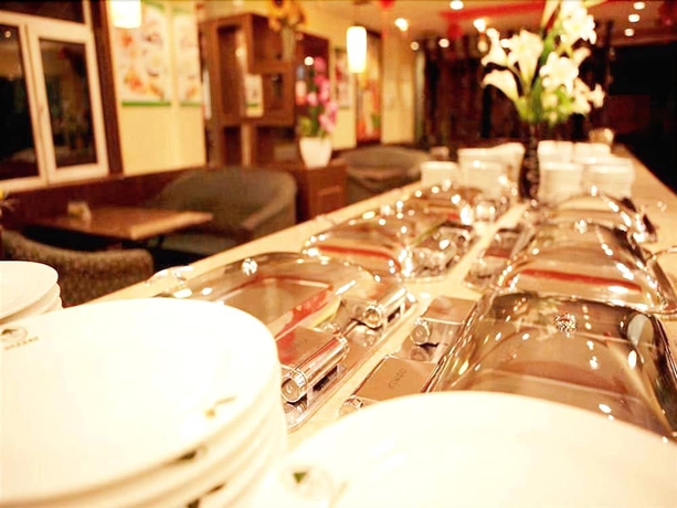 Imagen del bar/restaurante del Hotel Greentree Inn Shanghai Zhongshan Hutai Business. Foto 4