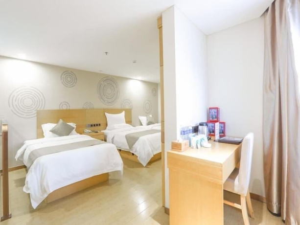 Imagen de la habitación del Hotel Greentree Inn Suzhou Zhangjiagang Yangshe Old Street Stadium Express. Foto 18
