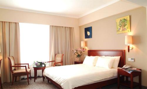 Imagen de la habitación del Hotel Greentree Inn Tianjin Meijiang Convention and Exhibition Center Express. Foto 6