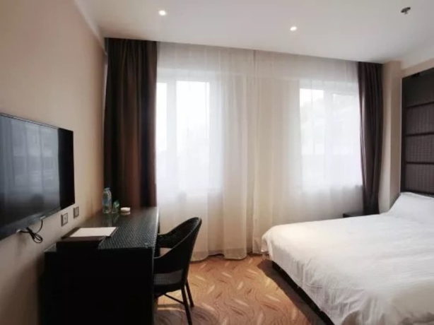 Imagen de la habitación del Hotel Greentree Inn Weihai International Beach. Foto 7
