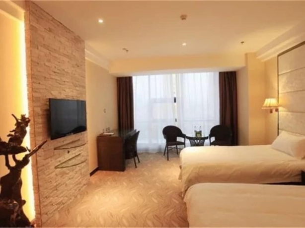 Imagen de la habitación del Hotel Greentree Inn Weihai International Beach. Foto 11