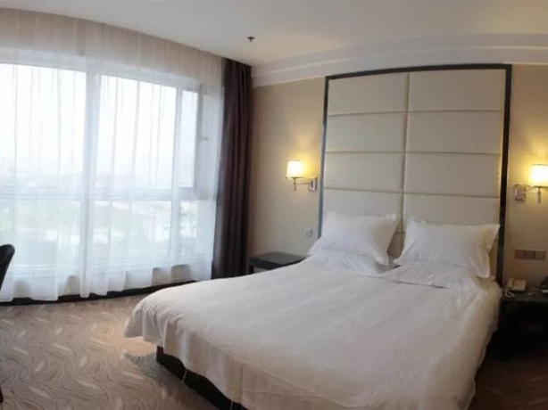 Imagen de la habitación del Hotel Greentree Inn Weihai International Beach. Foto 14