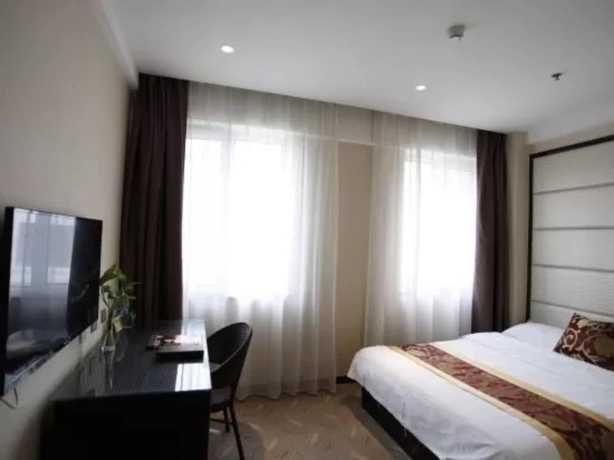 Imagen de la habitación del Hotel Greentree Inn Weihai International Beach. Foto 16