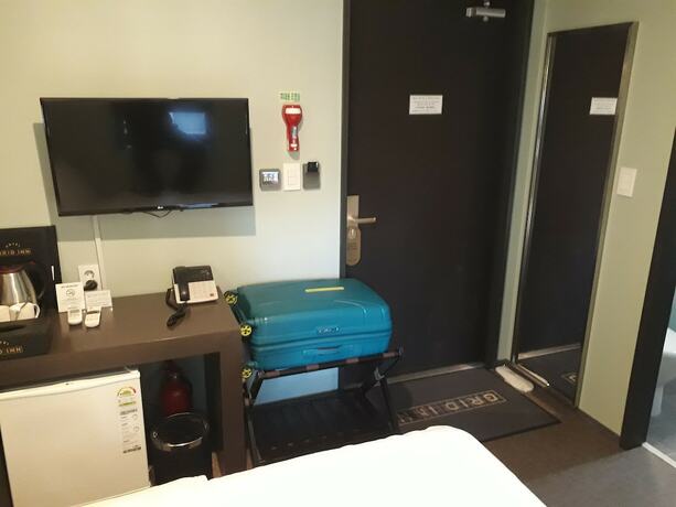 Imagen de la habitación del Hotel Grid Inn. Foto 12