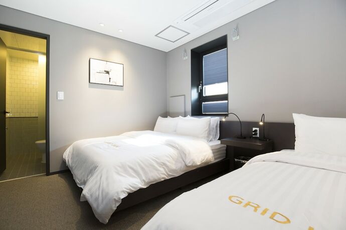 Imagen de la habitación del Hotel Grid Inn. Foto 18